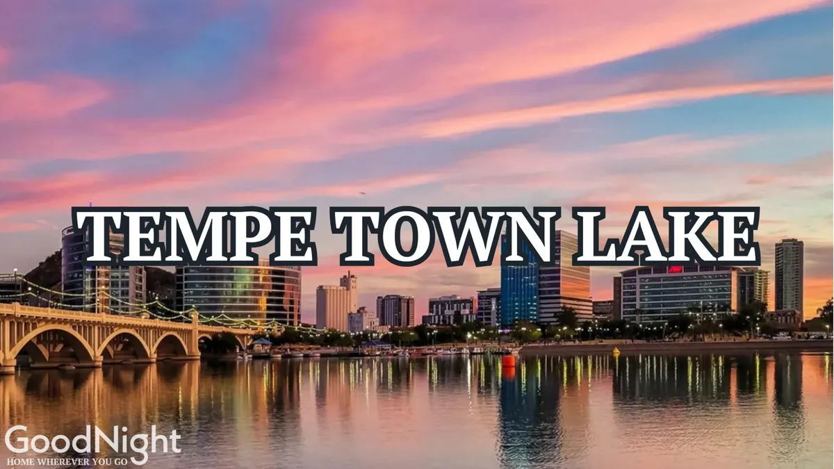 A scenic view of Tempe Town Lake with the city skyline and a bridge reflected on the water, surrounded by lively outdoor activity. People are seen walking along the shore, and the tranquil surface of the lake hints at a relaxing atmosphere.